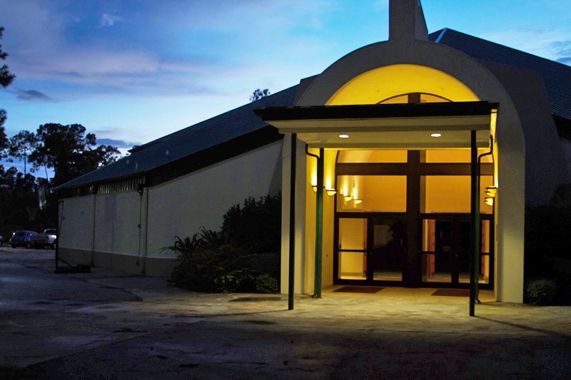 DRBC church entrance lit up at dusk